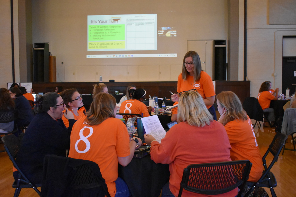 Amanda Morris gathering information from a team