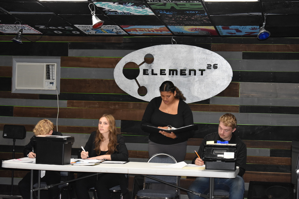 Student is mid debate while others look on