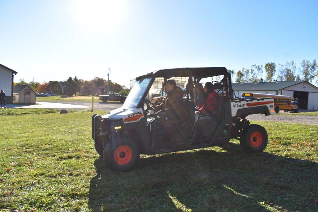 Students on a side by side ride