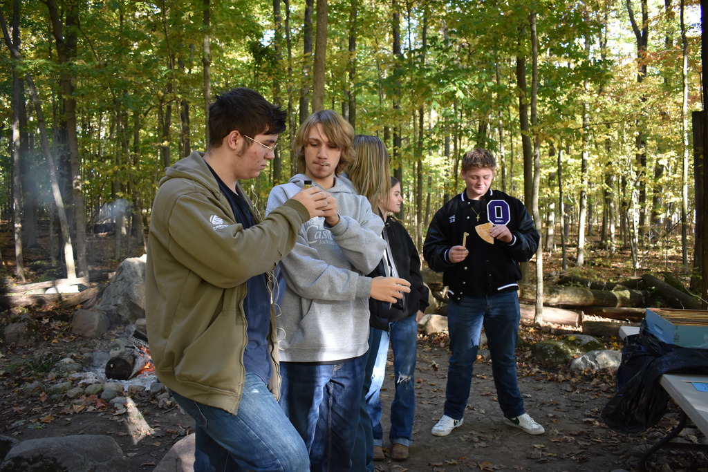 Students exploring honey and the bee projects at the farm