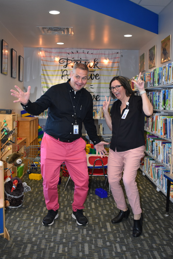 Mark Haag and Alena York posing in their pink pants
