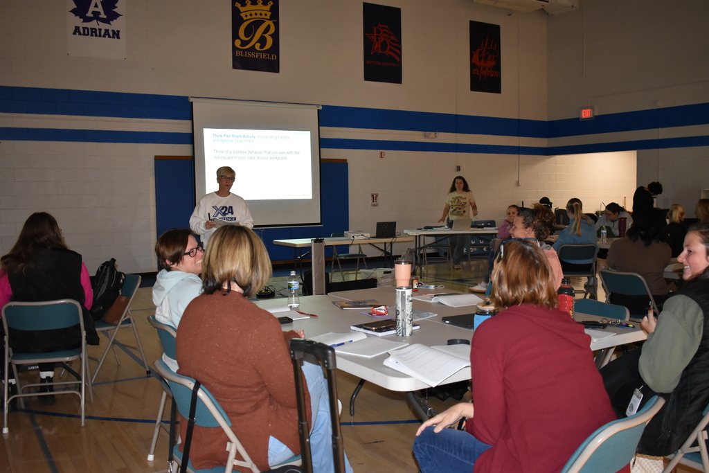 Someone asking a question to a full group