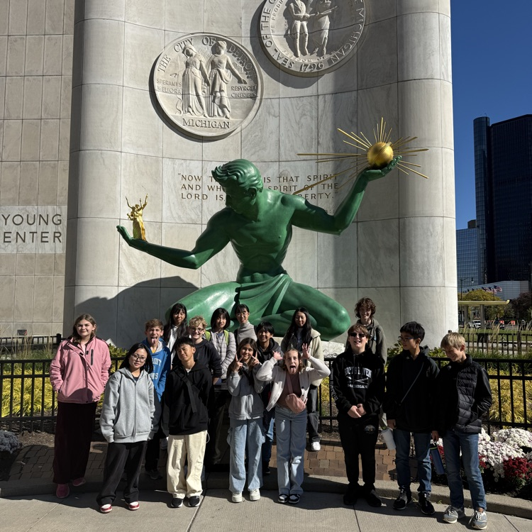students posing for a photo outside historic site