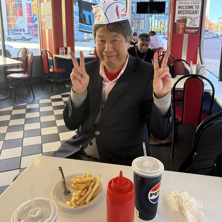 Teacher enjoying a meal at Coney Island 