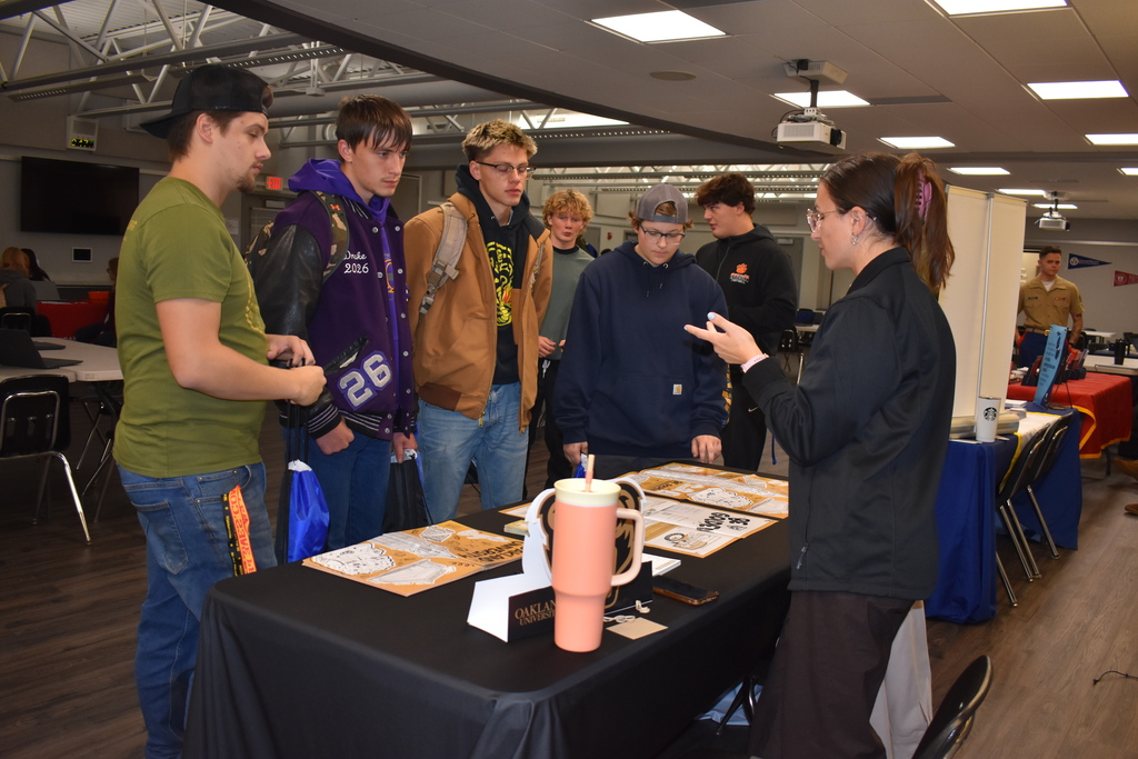Students chat with a rep from Oakland University