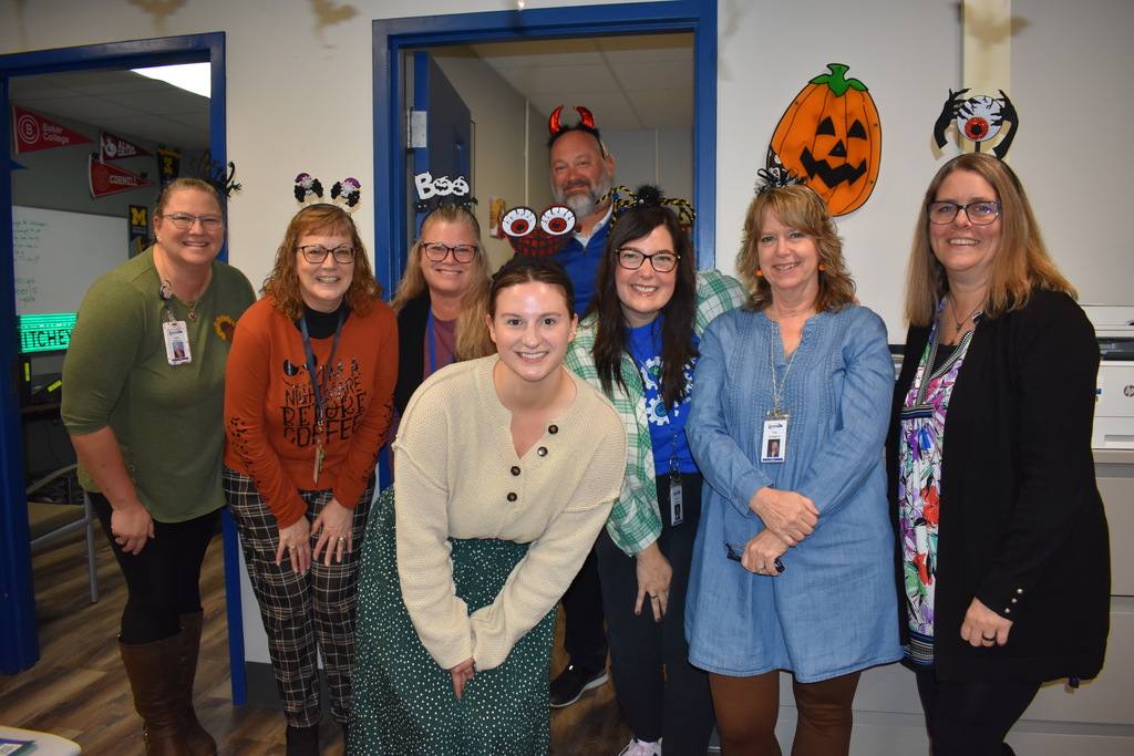 Staff posing with their Halloween headbands on
