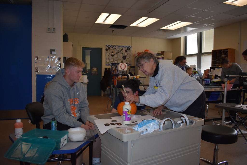 Helping a student with his pumpkin