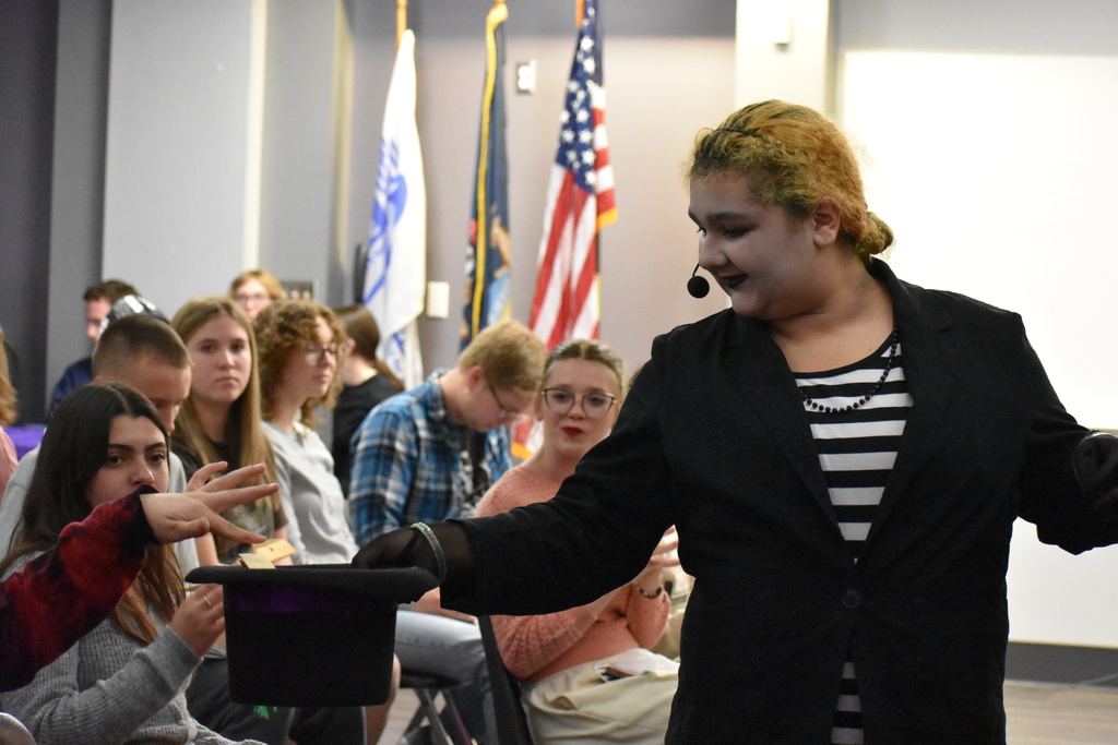 A student collecting responses during the play 
