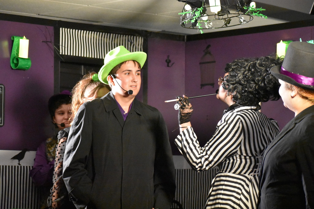 The detective arrive on set during the play