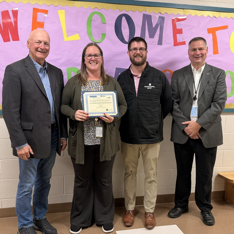 four adults and one receiving an award