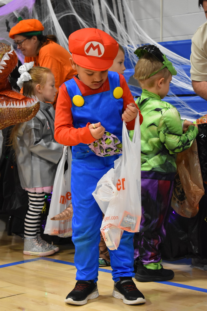 A student puts candy in his bag