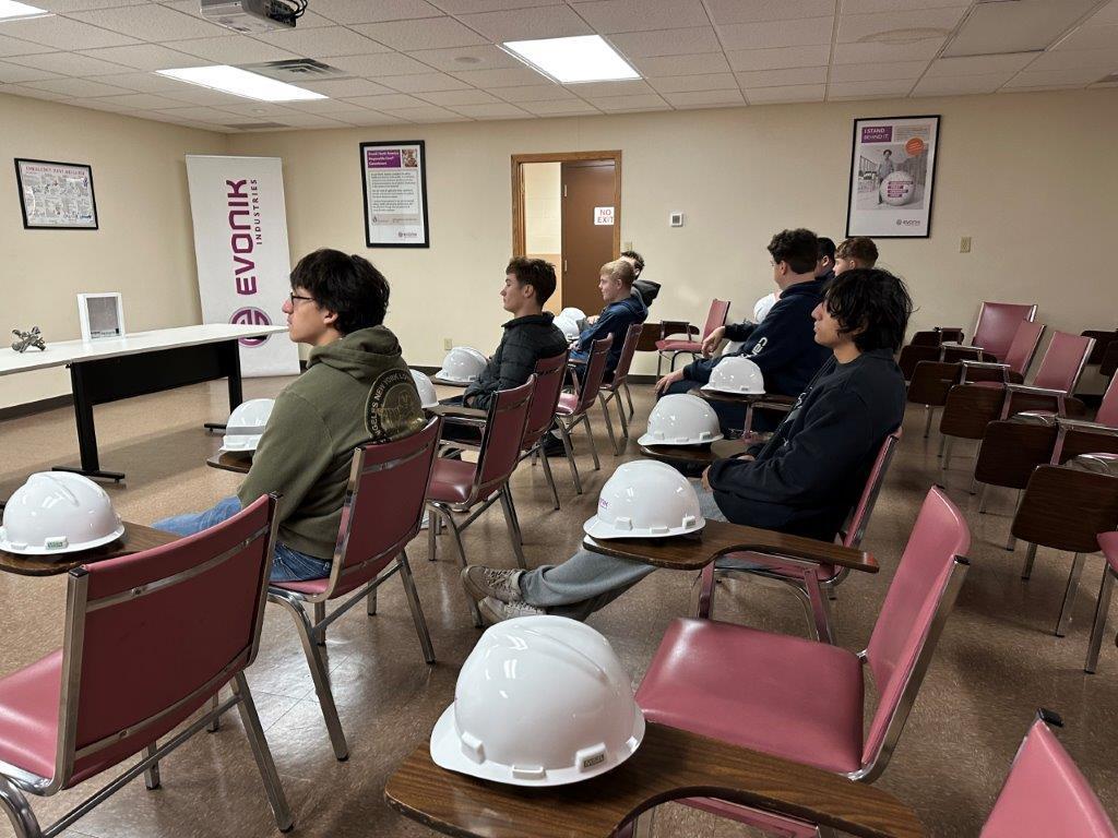 Adrian students listening in at Evonik