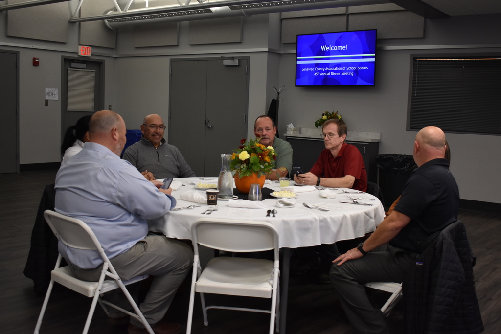 The Madison School board at a table