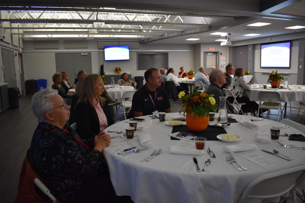 School board members seated in the room for the presentation