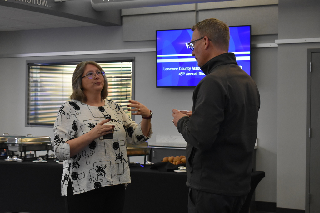 Tecumseh superintendent and board member chatting