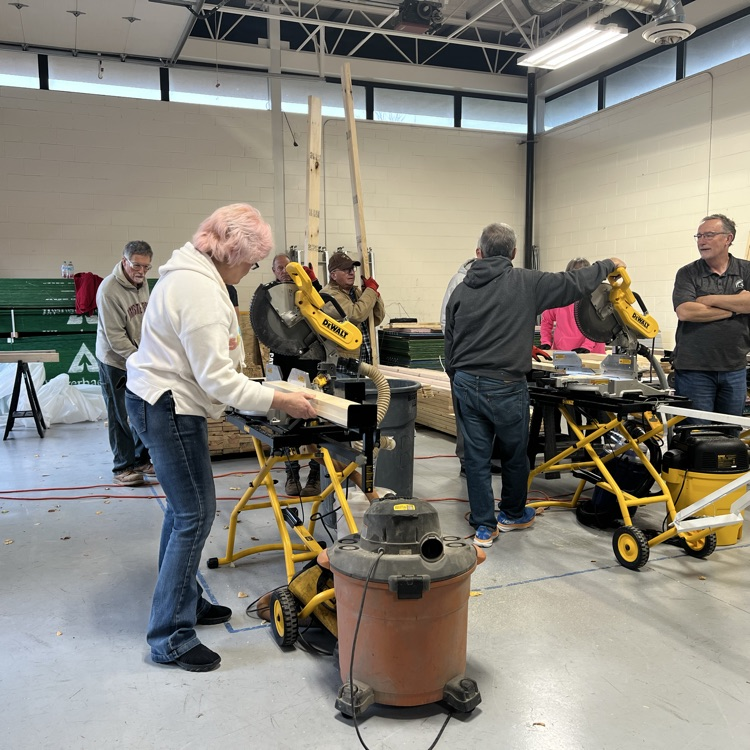 a woman cutting wood