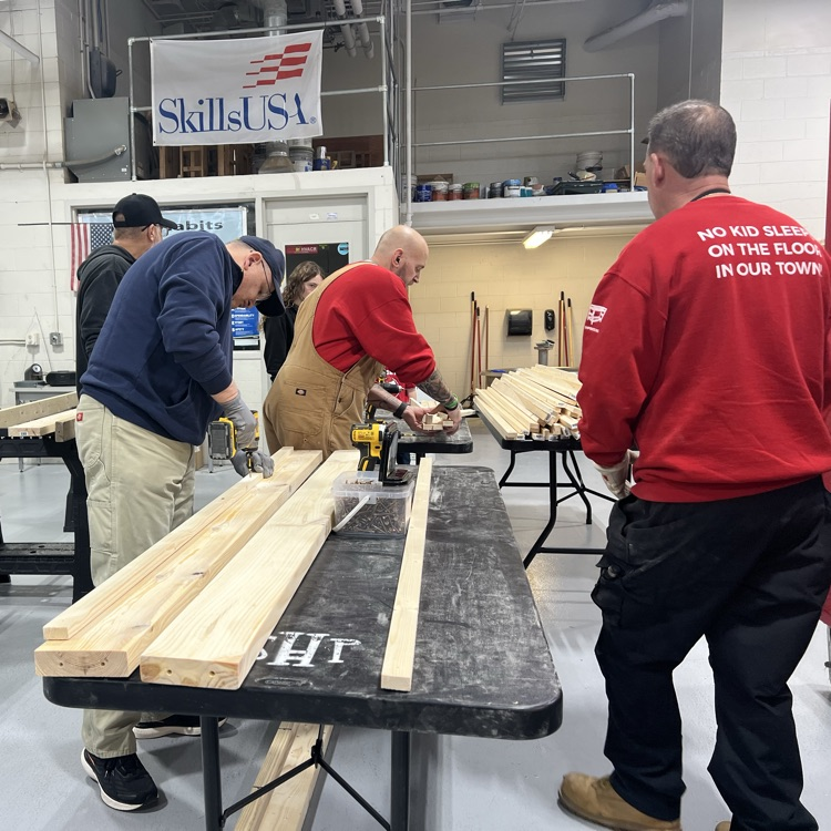 two people cutting boards