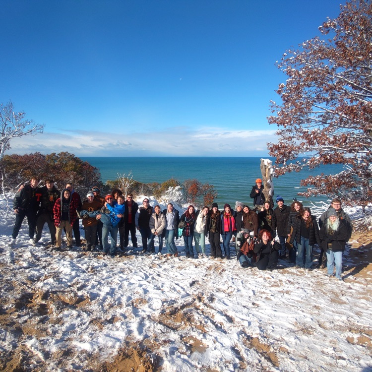 students with Lake Michigan behind them