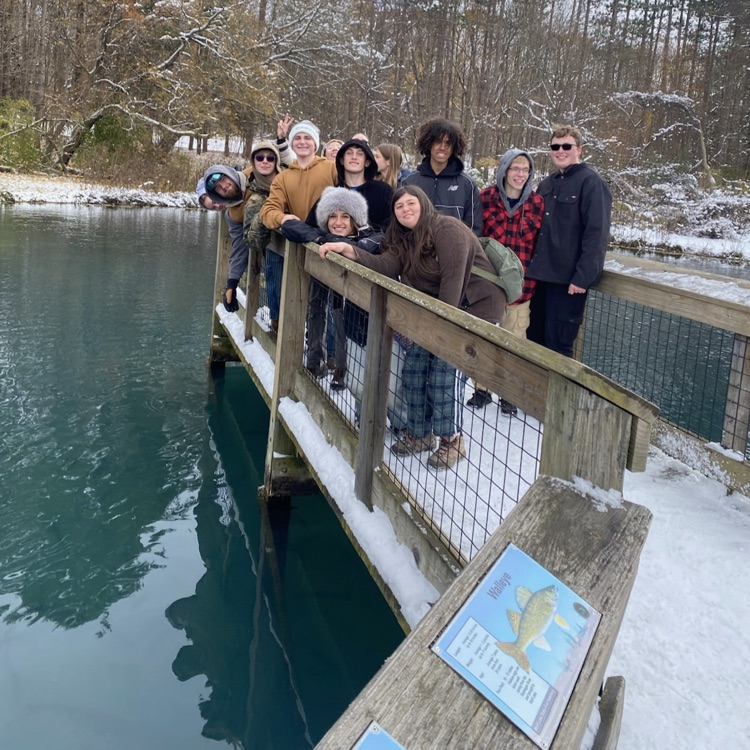 Students posing near water