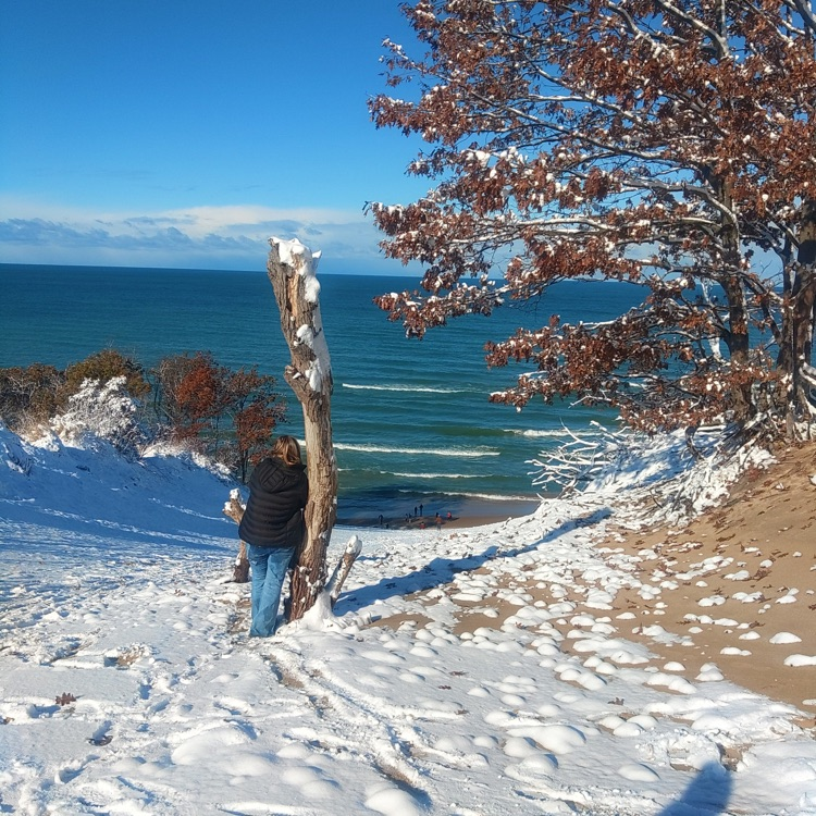 a person looking out at the lake 
