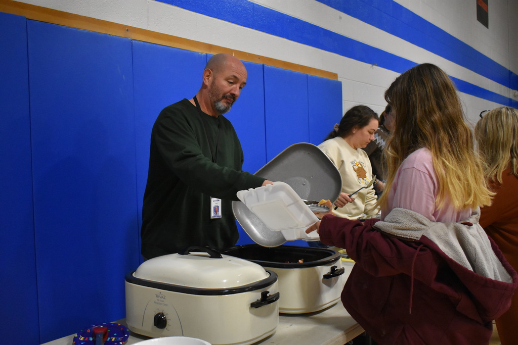 Travis Boring serving a student