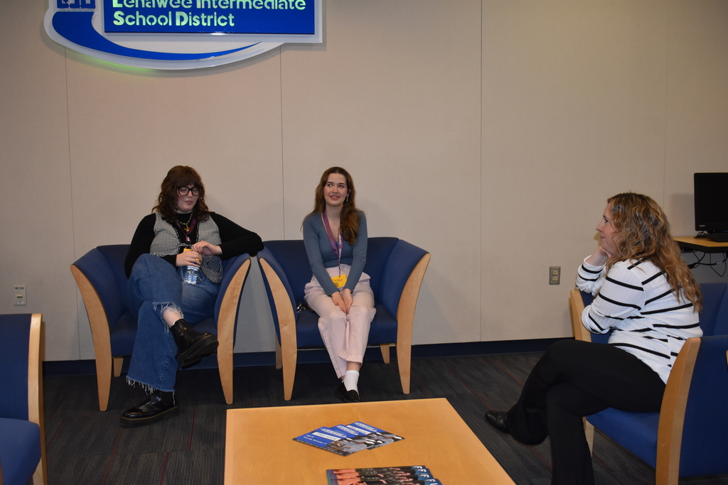 Alum chatting with staff