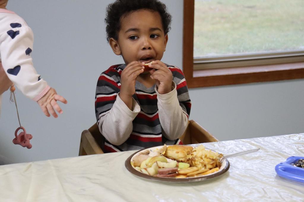 A PREP student's child eating a meal