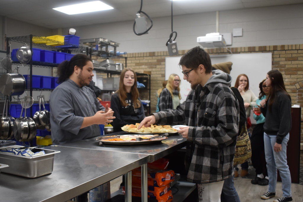 Students touring Hospitality and making a sandwich
