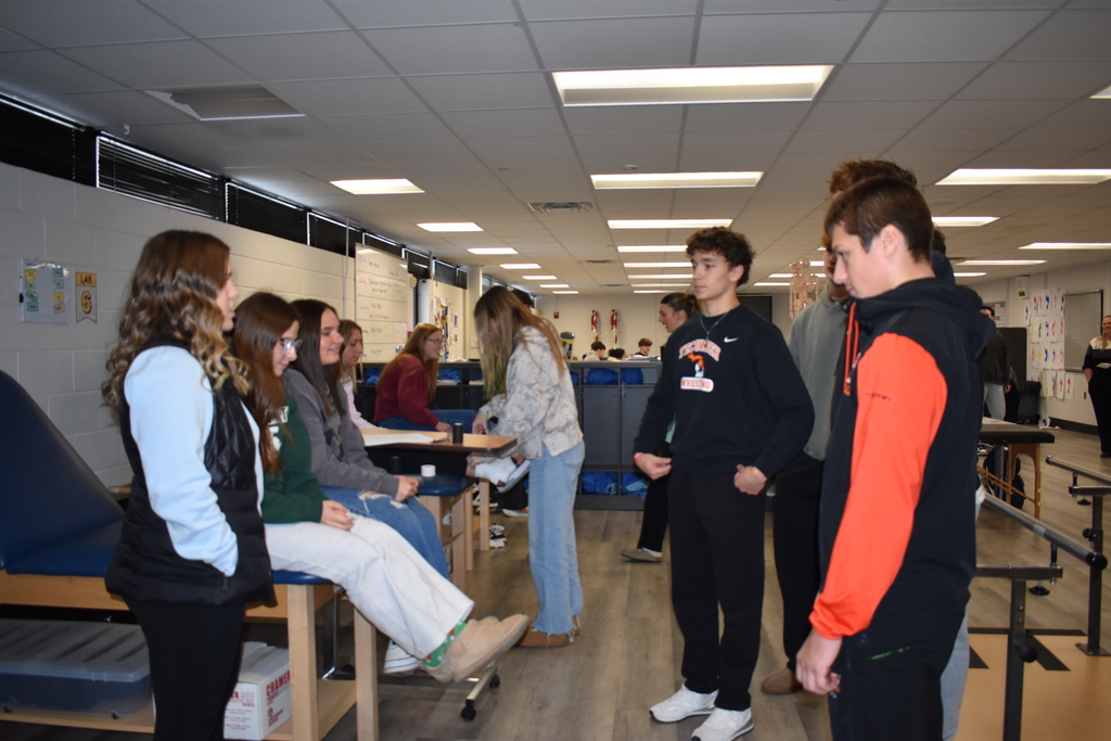 Students getting a lesson about HOSA from students