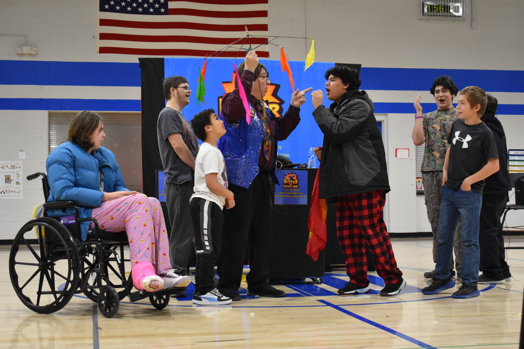 Students showing how shocked they are about a magic trick