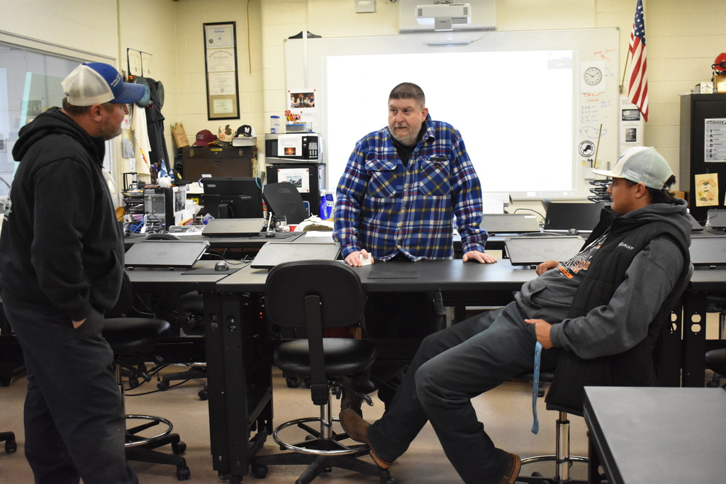 Our Machining and CAM instructor chatting with a parent