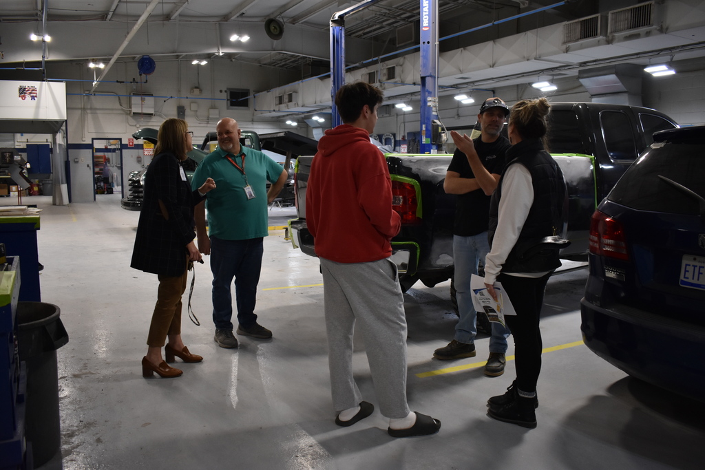 People learning about the Collision program from the instructor