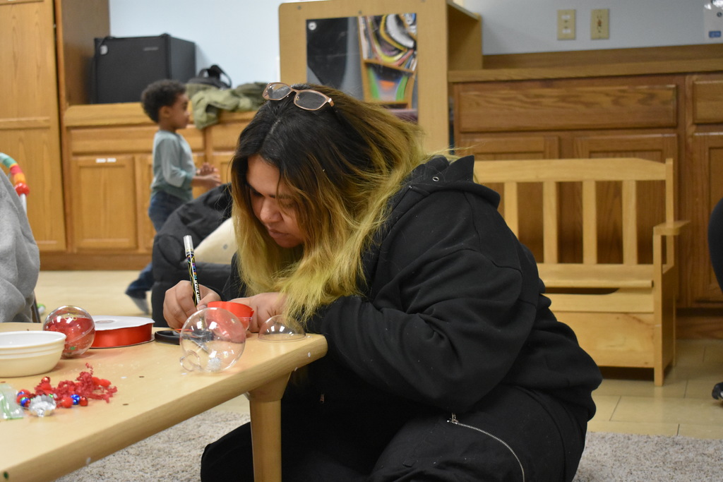 A student working on her ornament