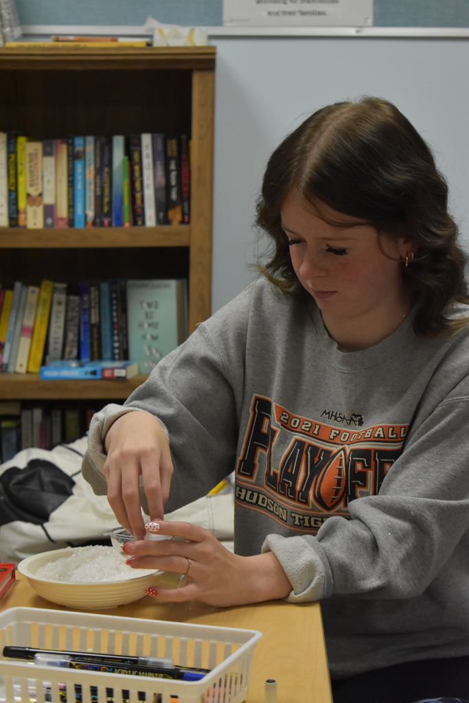A student making her ornament