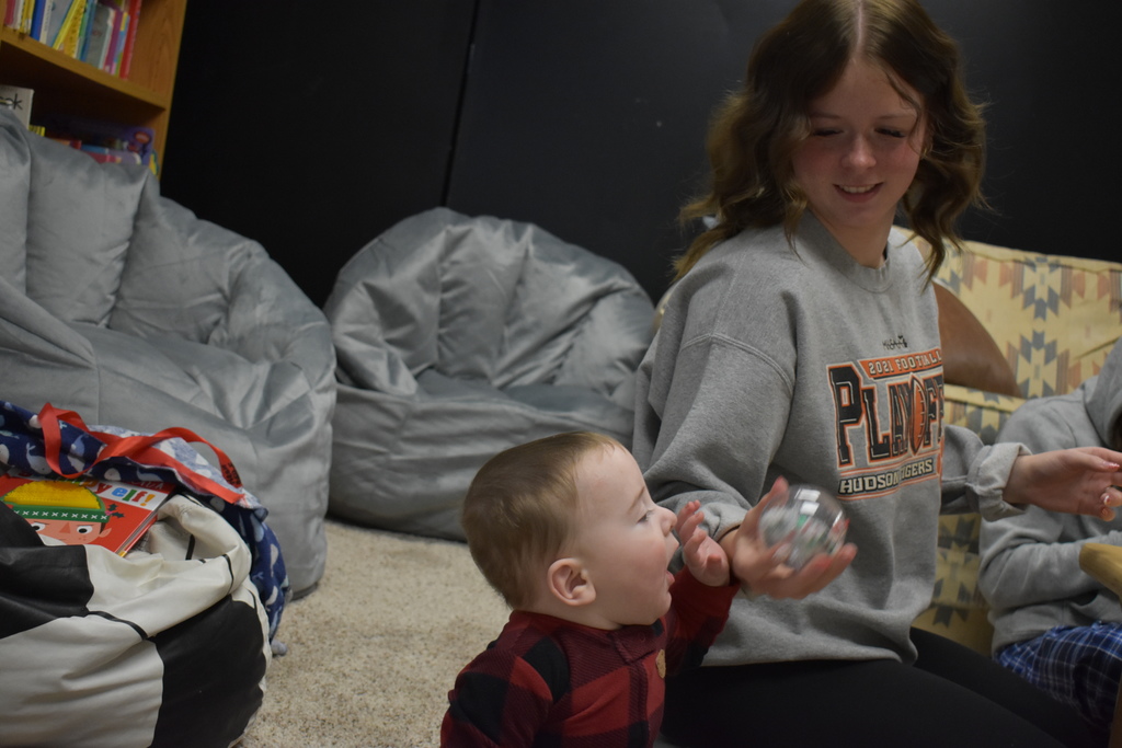 A child enjoying a bulb ornament