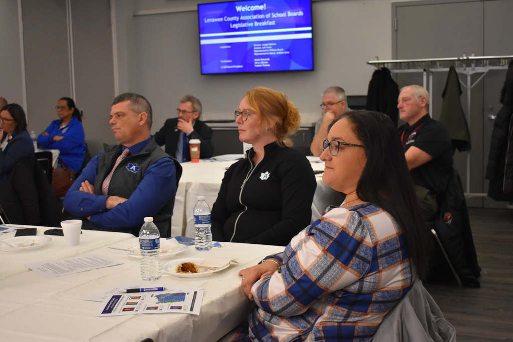School board members and superintendents listening