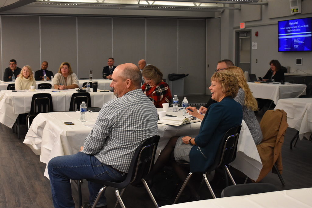 School board members and superintendents listening