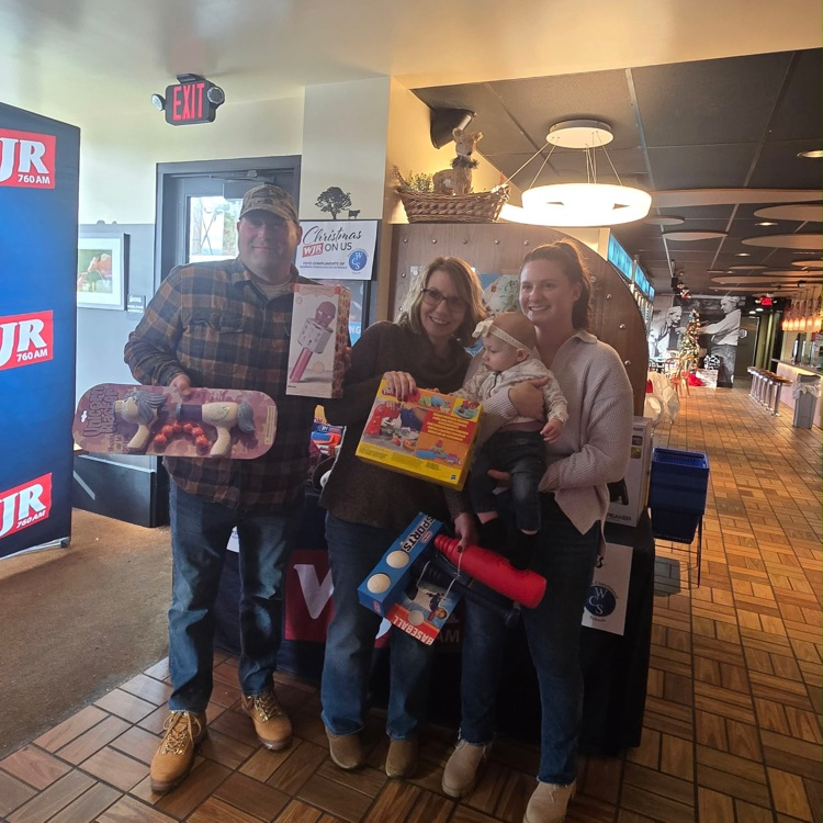 Mikayla and her daughter with some toys they received