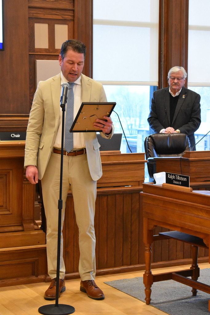 Commissioner Dustin Krasny reading the proclamation 