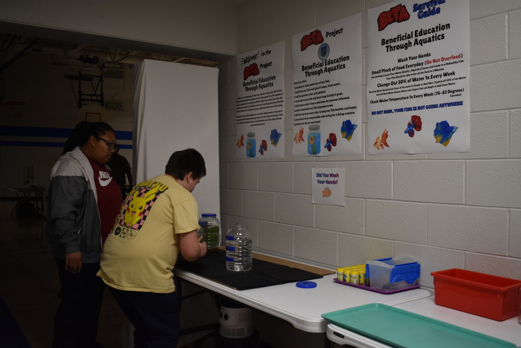 Student placing his aquarium on a heated mat