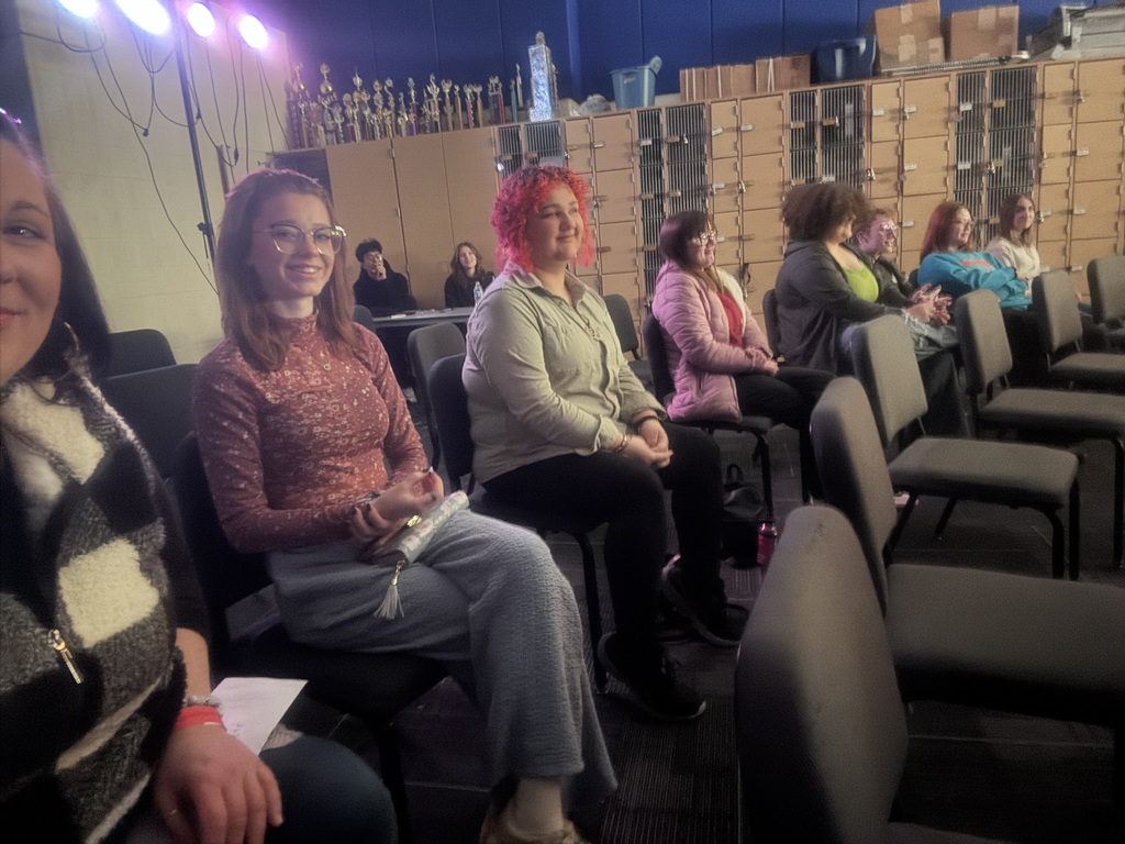 Students seated waiting for the improv show to start