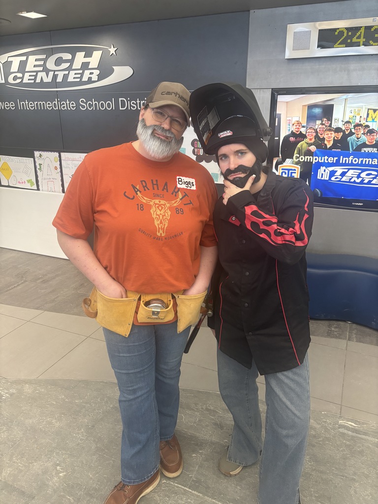 Two bearded staff members