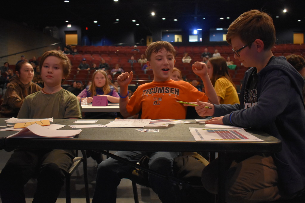 A student celebrating a correct answer
