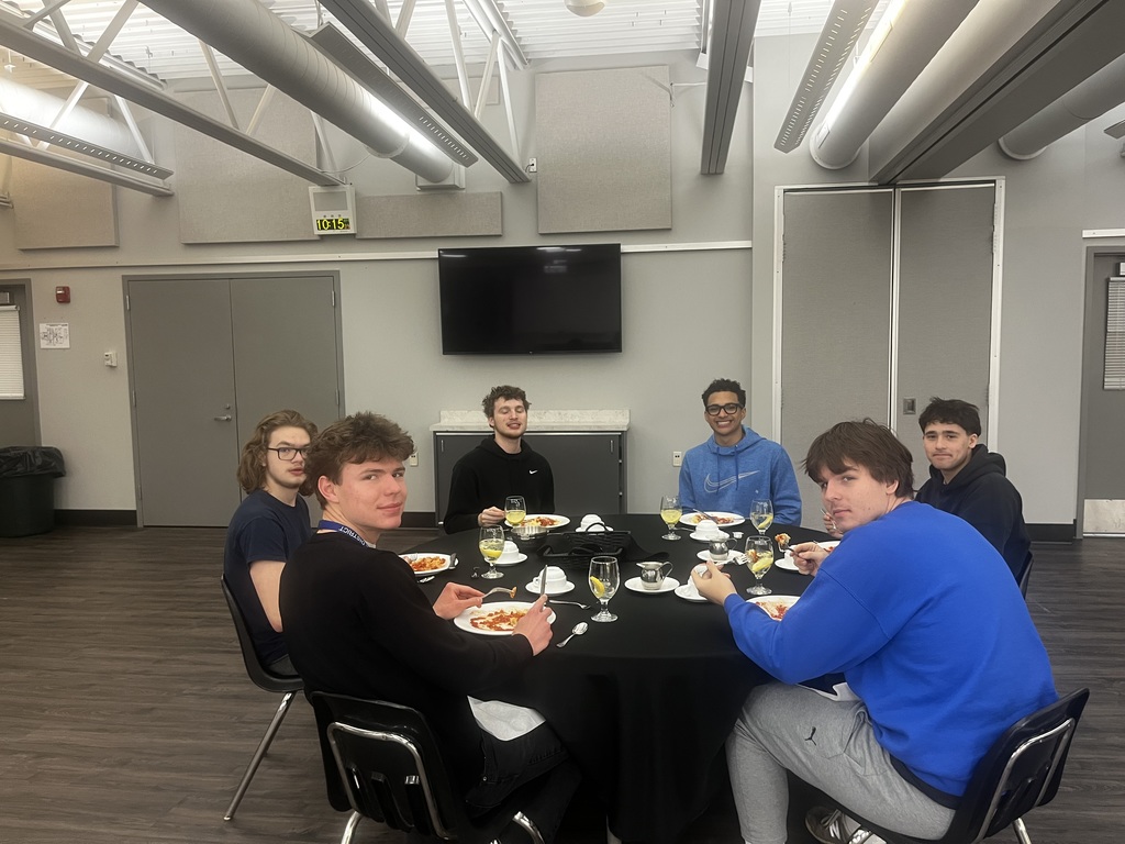 Students sitting around their dinner table