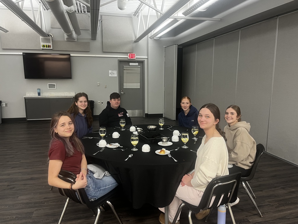 Students sitting around their dinner table