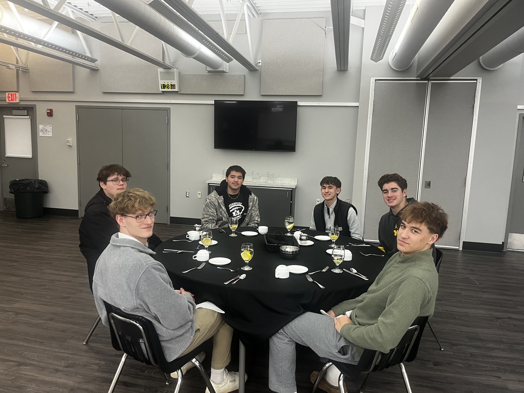 Students sitting around their dinner table