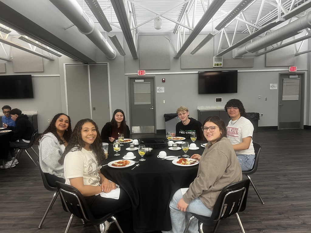 Students sitting around their dinner table