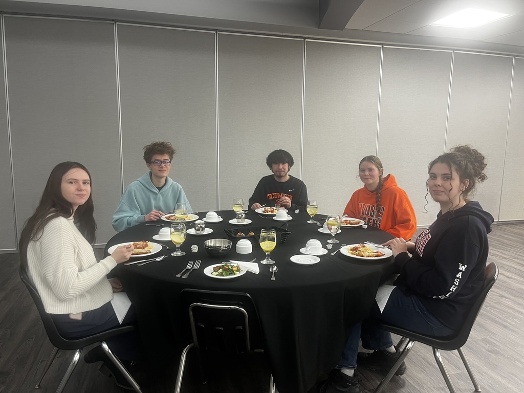 Students sitting around their dinner table