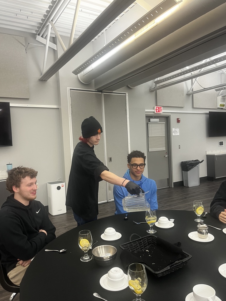 A student being served water