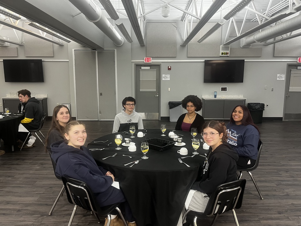 Students sitting around their dinner table
